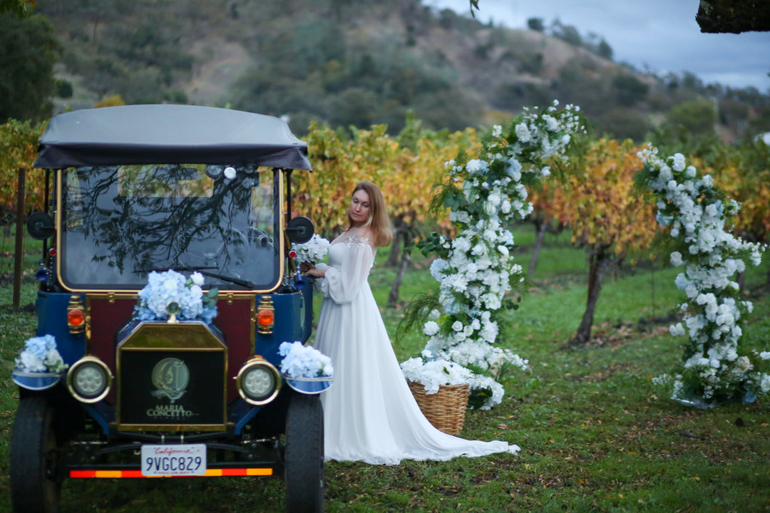 “Marriage proposal at Maria Concetto Winery in Calistoga”  “RobinoVino robotic sommelier proposal experience”  “White floral proposal arch at Maria Concetto Winery”